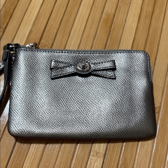 Coach Silver Turn Lock Wristlet with Bow Accent - Picture 1 of 4